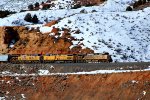 UP 5282, 6420, 2573 (C45ACCTE, C44AC, ET44AH)lead an eastbound empty hopper train [a monster] at Castle Rock, Utah. February 19, 2022 {Winter Echofest}